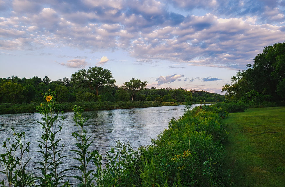 Shows a beautiful river similar to the James River where the community hall is located