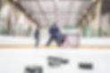 Hockey practice with coach and goalie