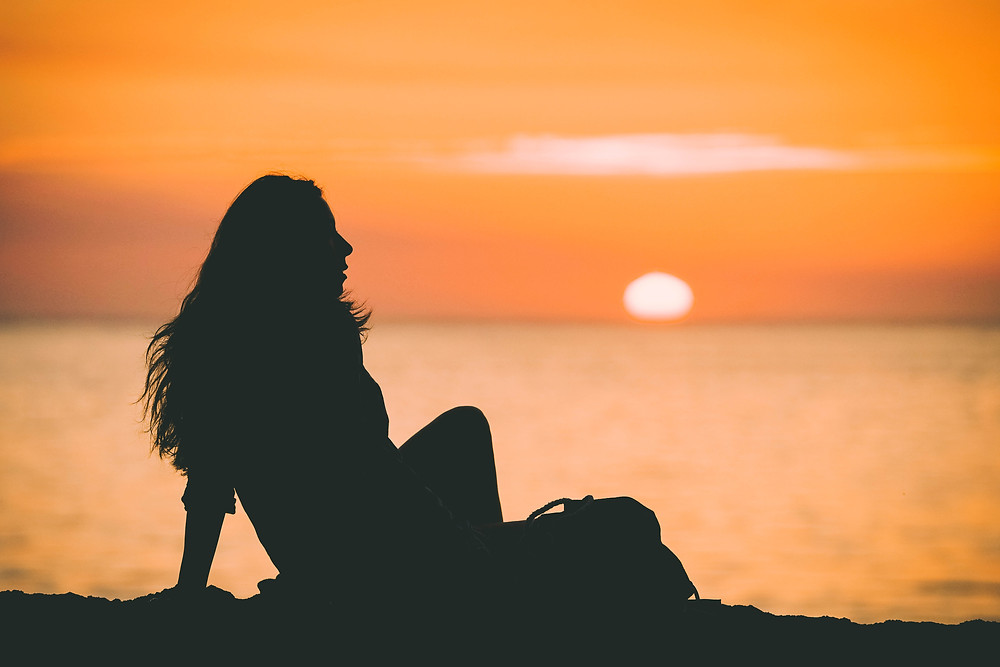 woman watching sunset