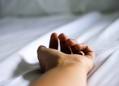 Hand laying on white table