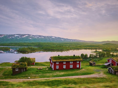 swedish country side lake and red country farm house sunrise