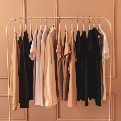 Minimalist capsule closet featuring neutral tones — beige blazer, white blouse, and taupe trousers styled in quiet luxury aesthetic