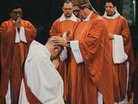 cardinal laying on hands