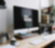 A nice work station with the words "do more" resembling what our service offers at Websytes