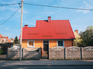 Inner city mango coloured render on a small house