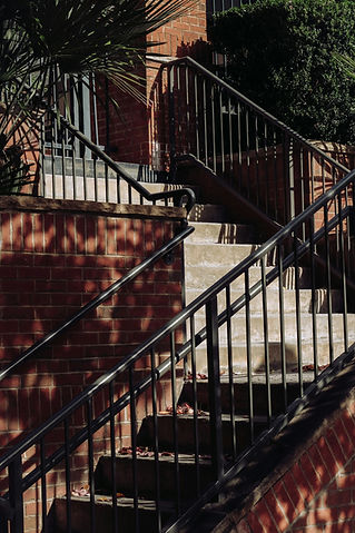 black metal staircase balustrade on outdoor brick steps