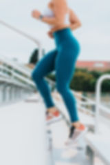 A woman running up stairs
