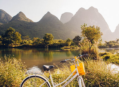 This 15-day cycling tour through China allows you to experience the country in a way few travellers do, moving at a relaxed pace on two wheels. As you cycle through villages and interact with local farmers, you become part of the landscape, sharing the roads with water buffalo, cyclists, and the occasional lumbering vehicle. The trip takes you through peaceful country roads, with a support vehicle always available for those moments when you need a break. The landscape is stunning, dotted with karst hills, rice paddies, and charming villages.
In addition to cycling, you’ll have the opportunity to explore some of China’s most iconic sites. In Xian, you’ll visit the Terracotta Warriors and the tomb of China’s first emperor, while in Beijing, you’ll explore the Forbidden City and take in the remarkable view of the Great Wall at the less-visited Mutianyu section. The journey also includes time in Yangshuo, where the beauty of limestone formations and tranquil rivers provides the perfect backdrop for cycling.
With its blend of cycling, history, and local culture, this trip offers a comprehensive view of China, from ancient sites to rural landscapes, and combines adventure with immersion in the country’s rich heritage.