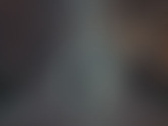 Man walking down street with Christmas lights