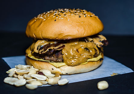 This grilled grilled crispy on the edge, sweet bacon jam and creamy peanut butter combination is the ultimate in unique burger creations.  Try this on game night with friends. 