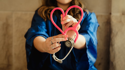 Doctor holding stethoscope in the shape of a heart