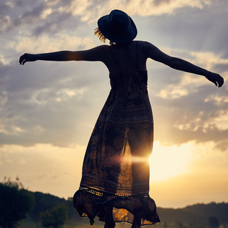 Person standing with outstretched arms