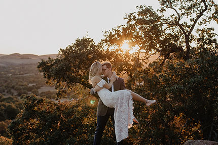 Bride and groom sharing a tender moment during a sunset wedding photoshoot