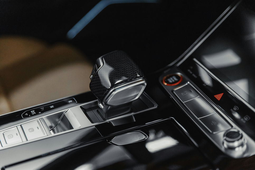 Luxury gear shifter close-up used for Nordel mobile car detailing page.