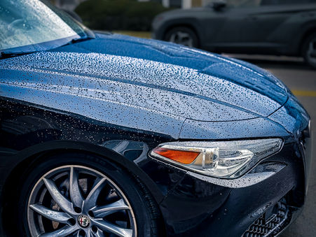 vehicle with ceramic coating performing its hydrophobic properties after LuxeShine Auto Detailing Edmonton's specialists installation.
