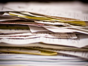 a stack of bills and receipts