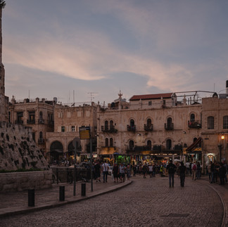 Twilight view of the Jaffa Gate entrance plaza and the hotels of the Old City, adjacent to the Tower of David battlements.