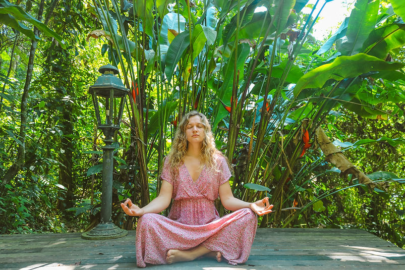 Girl meditating in forest
