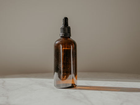Beard oil bottle with no label.