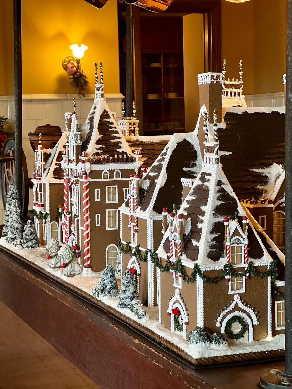 Ginger bread houses, ornately decorated, in a row.