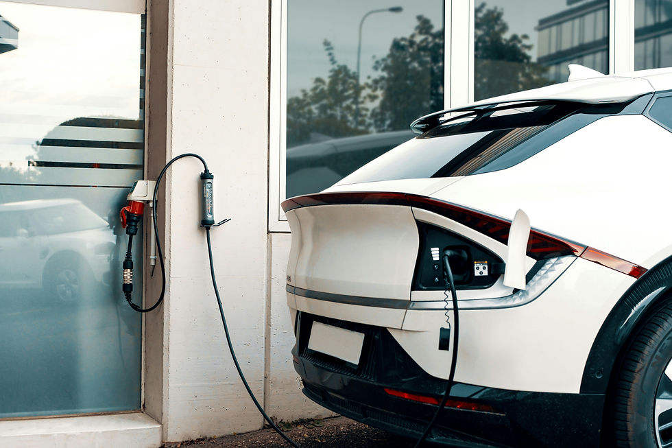 Electric car charging at a home EV charging point in a garage