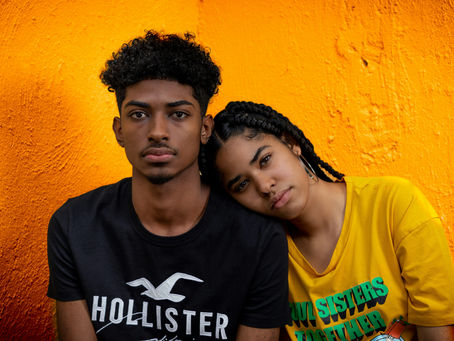 teenage boy and girl sitting together
