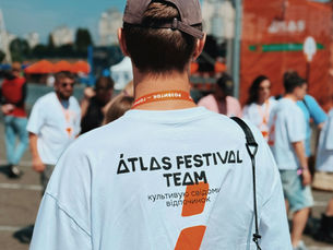 group of employees in matching branded t-shirts at a corporate event