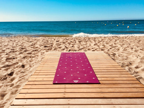 Yoga mat on the beach