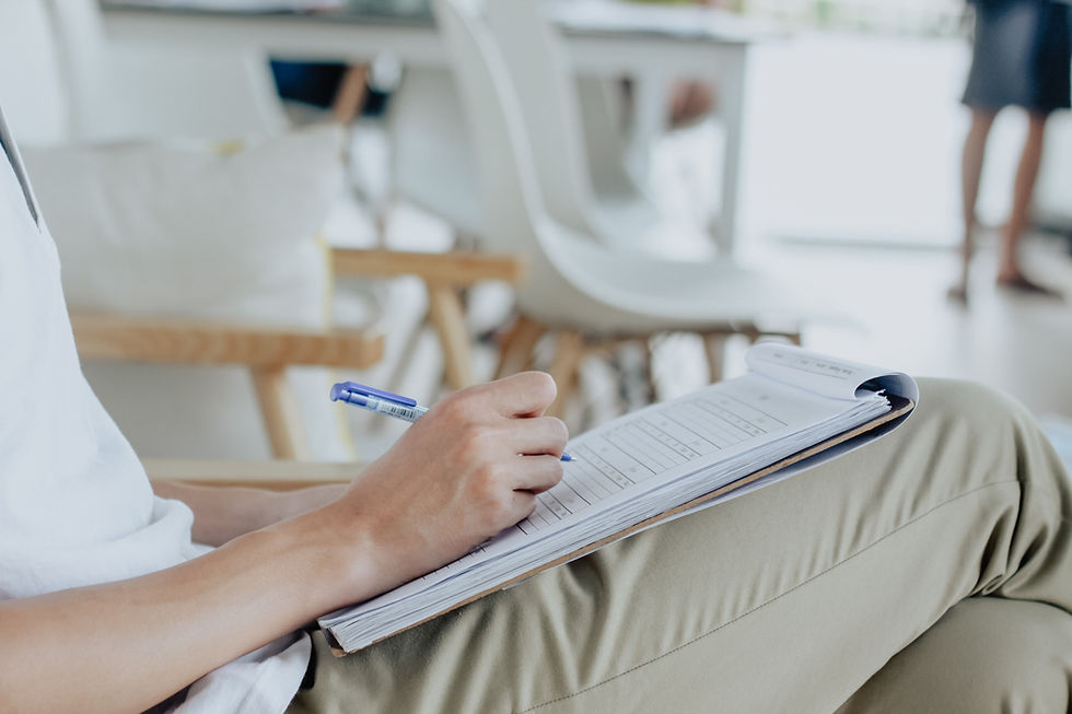 A lawyer studies case files and evidence photos, preparing to build a strong legal case for their client.