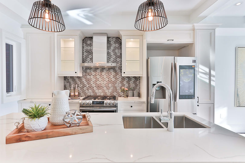 beautiful white kitchen with funky floral backsplash