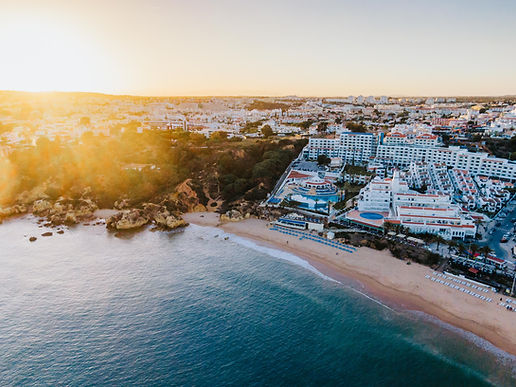 A beautiful drone shot of Albufeira beach representing the Algarve guide section by Lagos Homes your personal buyer’s agent to purchase your dream home in Portugal