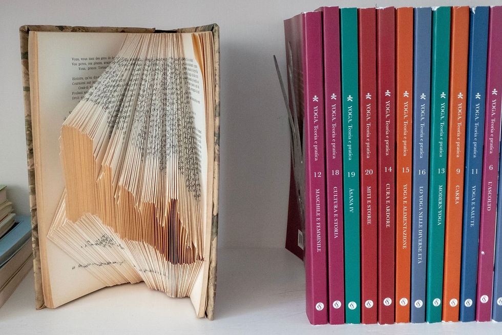 Book that has been turned into art by cutting the paper into geometric shapes