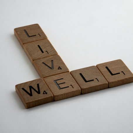 The words "Live Well" on scrabble letters
