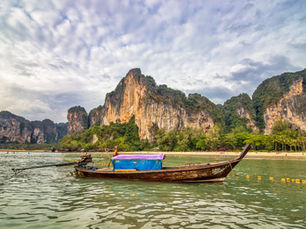 Limestone karsts and turquoise water at Railay Beach, Krabi, Thailand at sunset