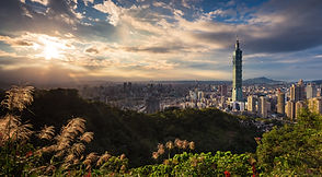 Taipei 101 rising over the city at sunset