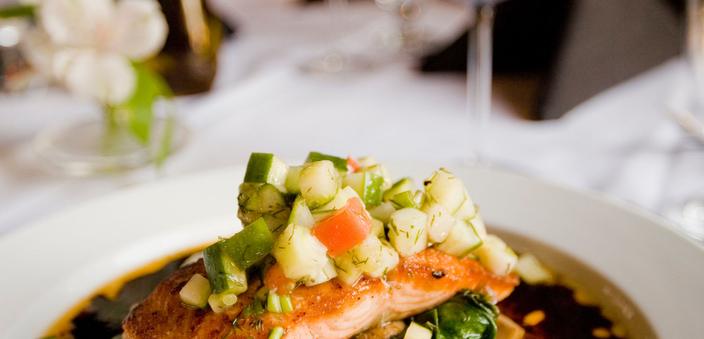 Pan-seared salmon with vegetable salsa and red wine.