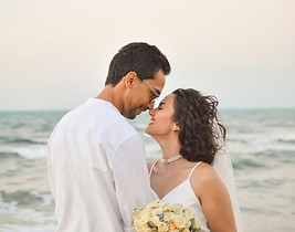 Bride and groom at beach wedding