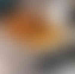 chicken strips and fries in a square dish