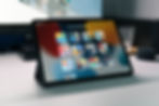 An open iPad. Screen showing multiple apps.