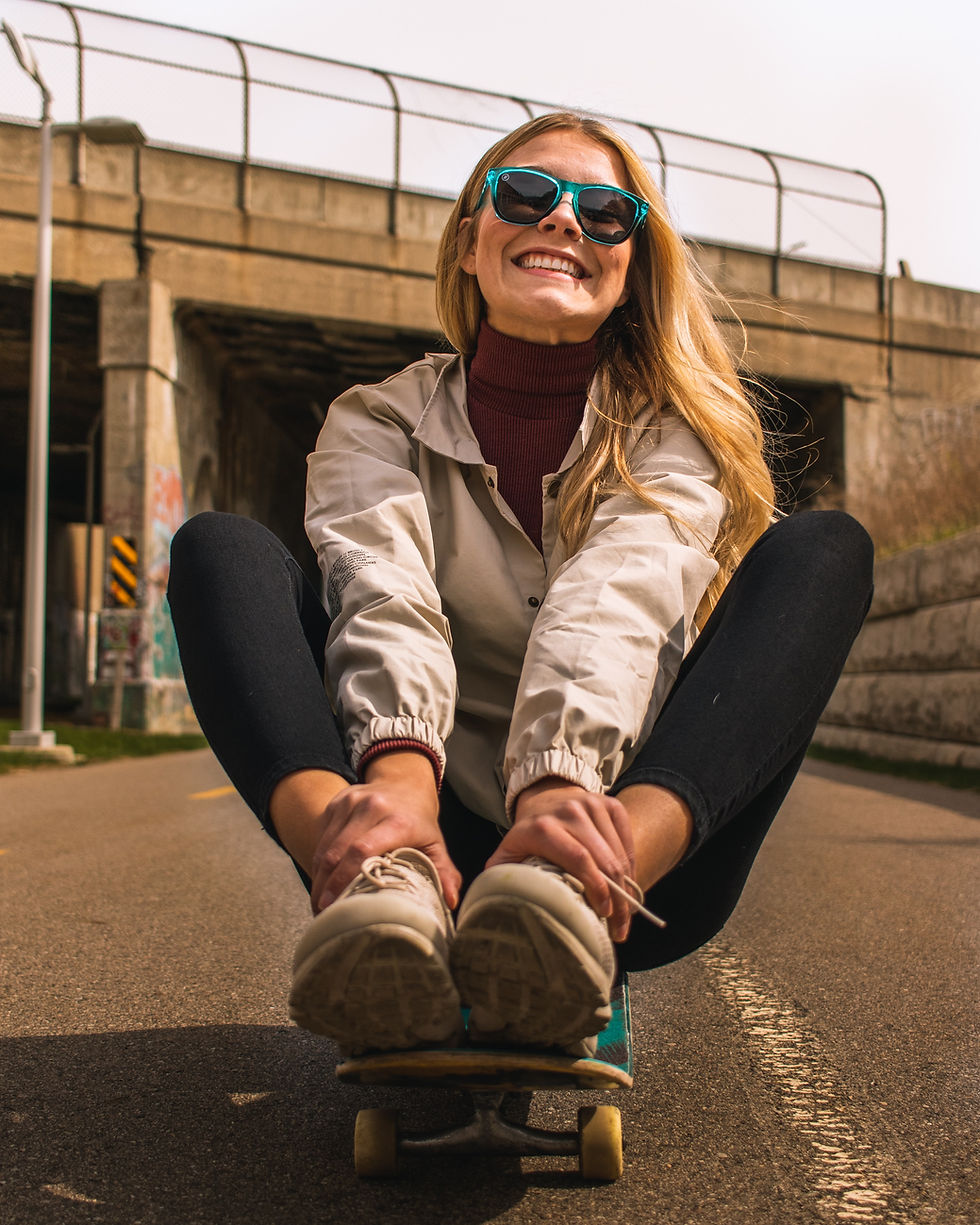 Young woman with a smile skating - Image by Daniel Lincoln
