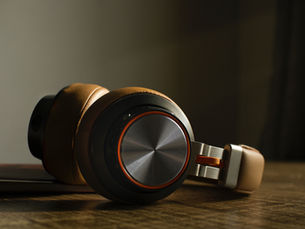 Surprising_Media. (2025). Headphones on a table.