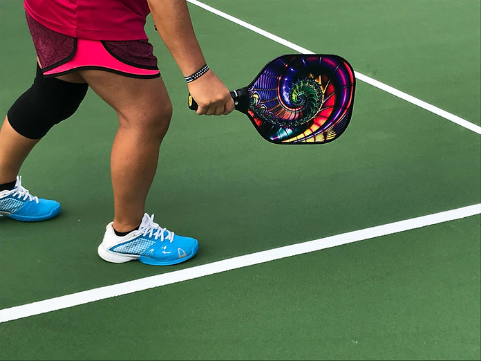 womans legs while playing pickleball