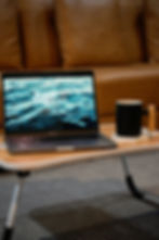 Image of a laptop and a cup of coffee