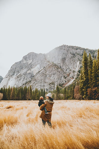 Happy mother and child in the mountains. Image by Nathan Dumlao from Unsplash