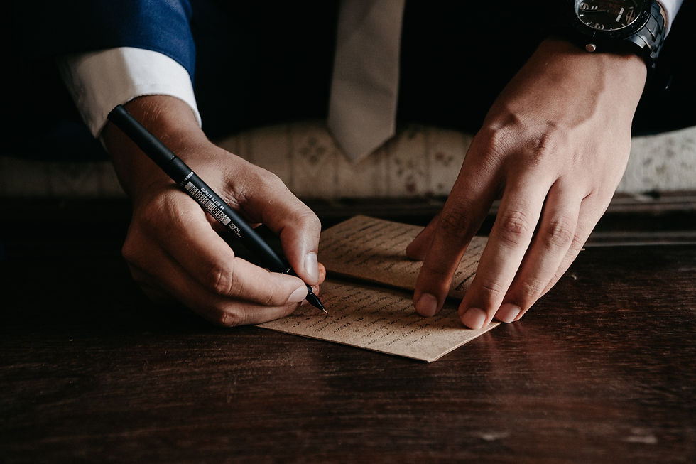 A serious injury lawyer talks calmly with an injured client, offering support and guidance while reviewing case documents in a quiet office setting.
