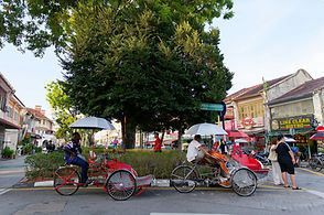 Trishaws parked on a heritage street in George Town, Penang