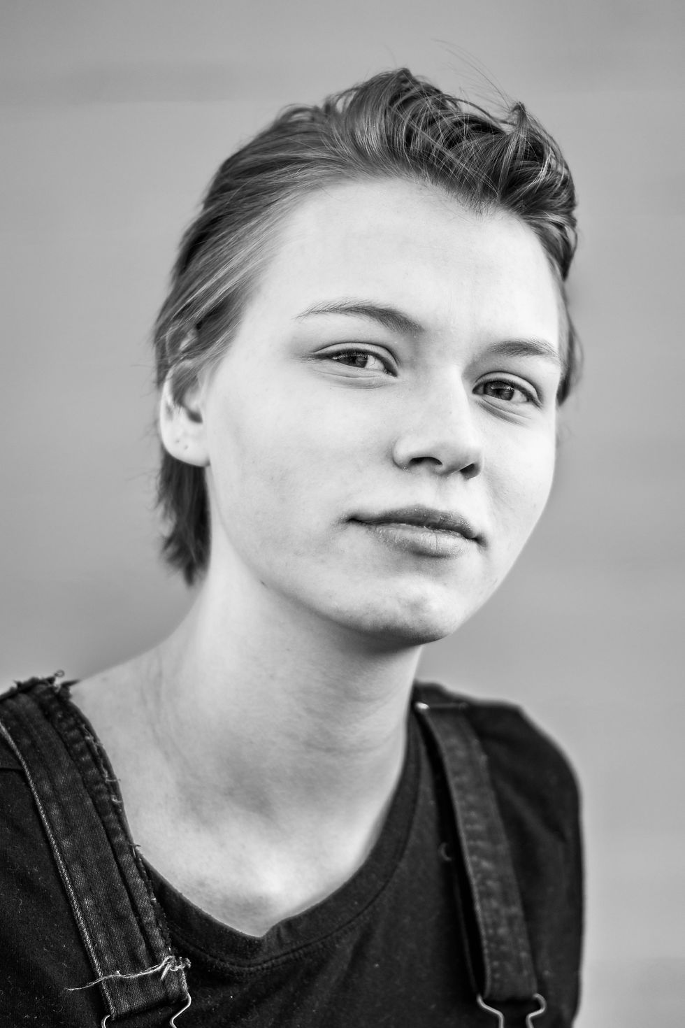 Close up black and white portrait of a teenage girl