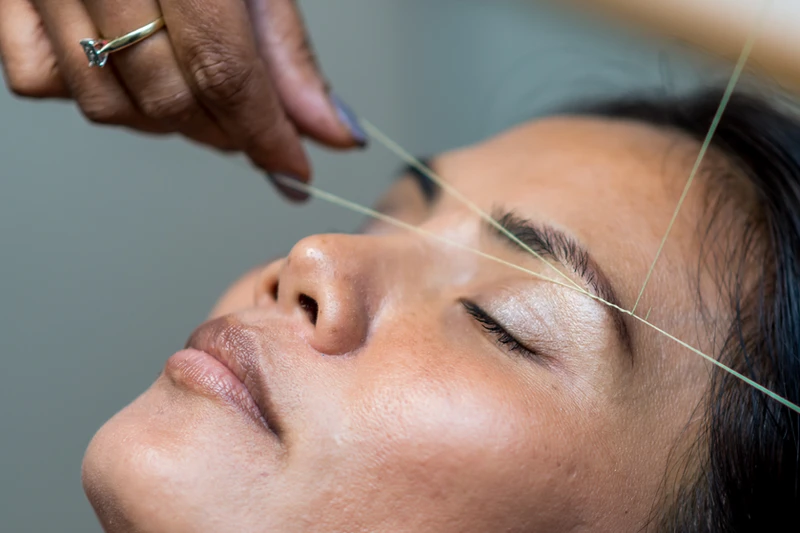 Women with Threading Technique 