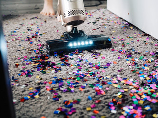 Spring Cleaning for Homeowners - Sweeping the Living Room floor