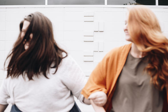 women locking arms together